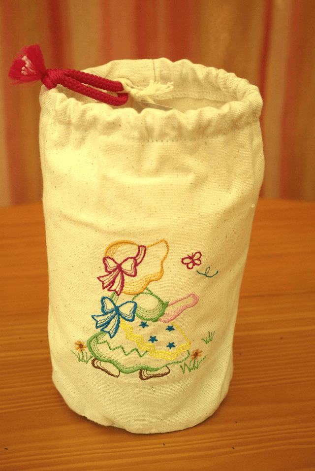 912.00/01/02/03-Sac à goûter brodé Diam 12 x 19 cm