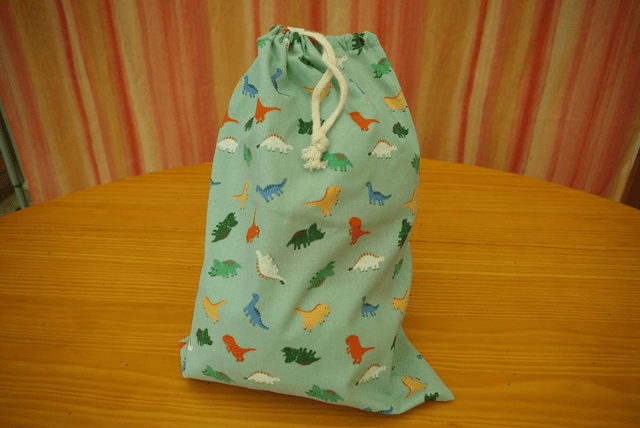 910.02-Sac à doudou &quot;dinosaures&quot; L22 x H31